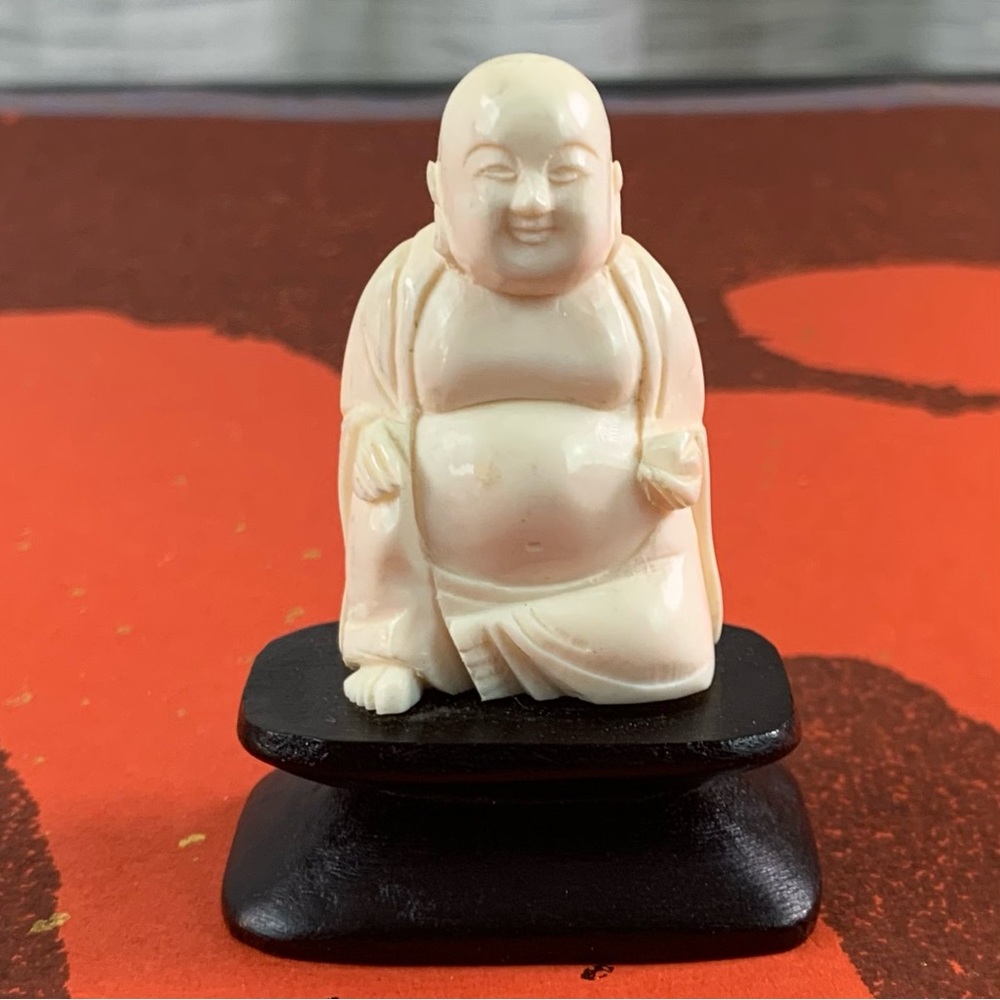 Miniature white Buddha.